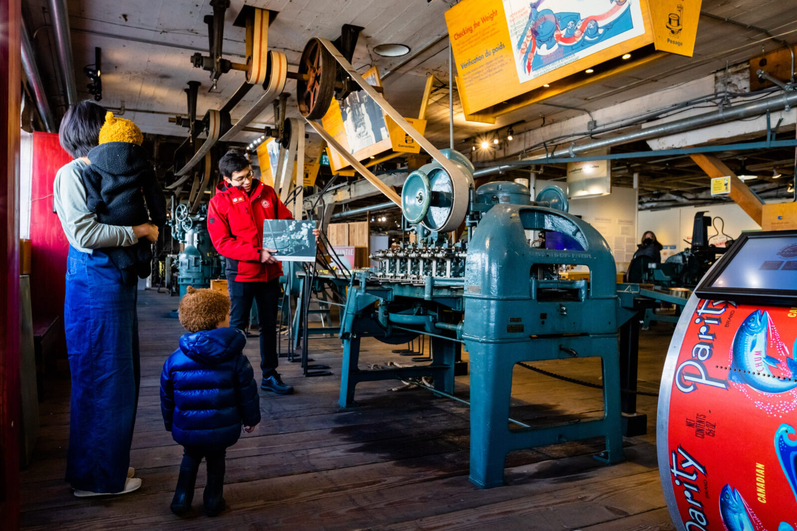 Interpreter showing family historical photo on Canning Line tour