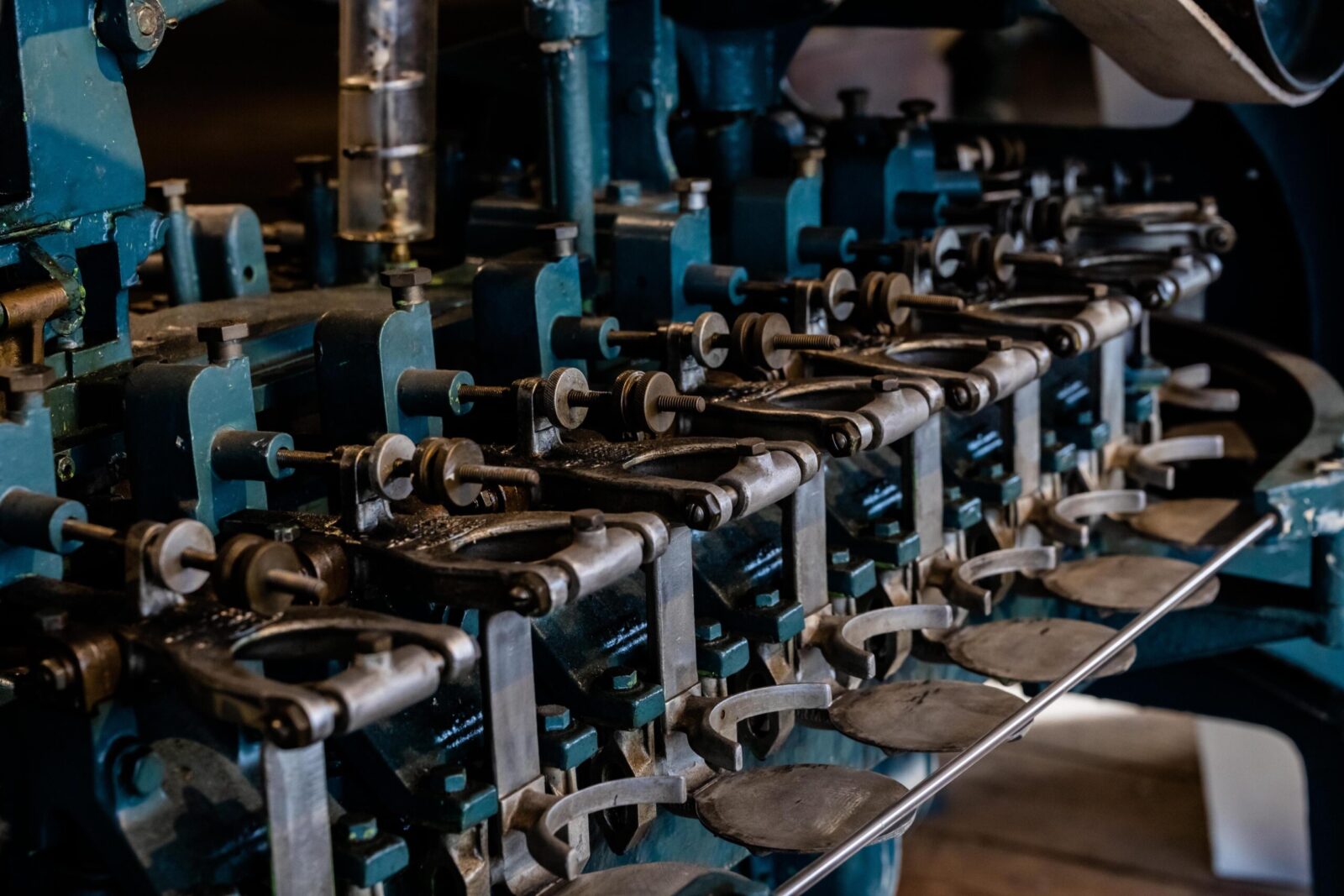 Close up machines used to weigh filled salmon cans